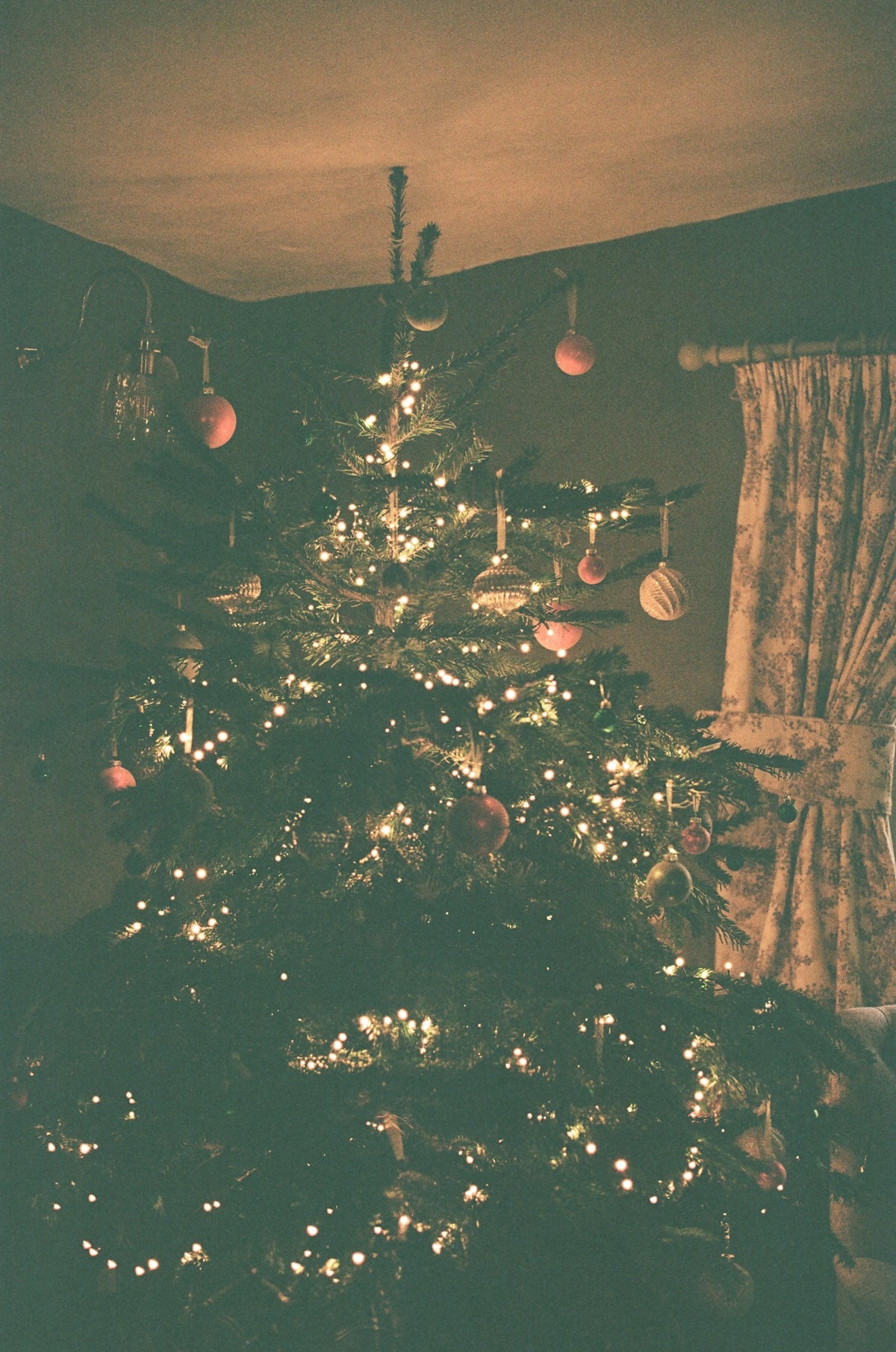 A decorated christmas tree with lights and ornaments.